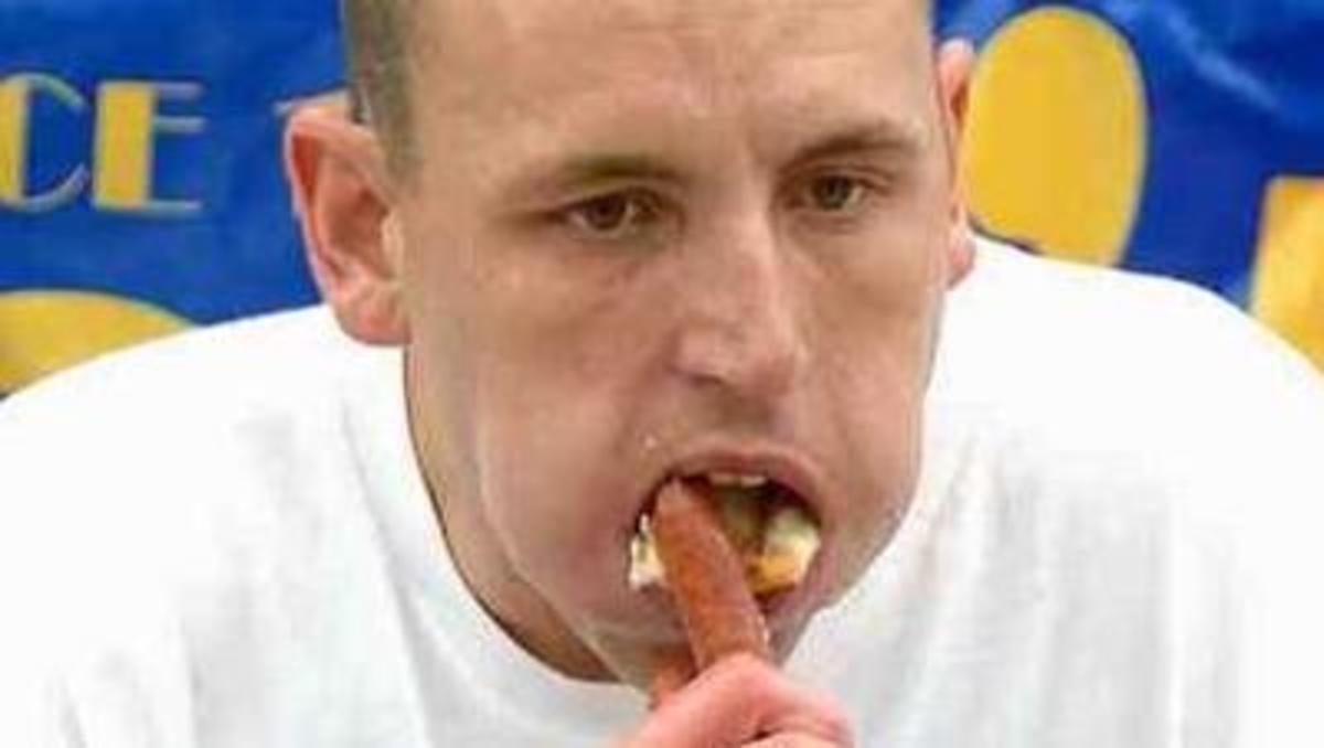 Joey Chestnut competing in  Nathan's Hot Dog  Eating Champ.