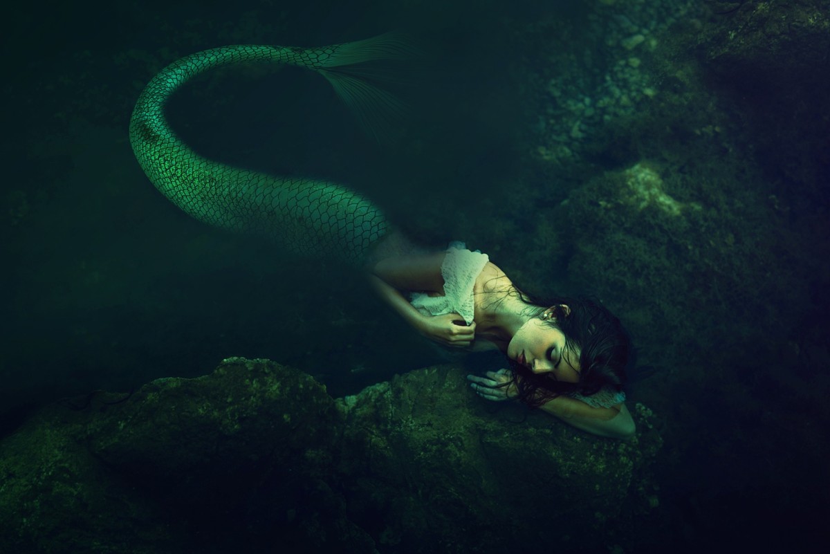 A mermaid is a hybrid mythological being that is half human female, half fish. A merman is its male equivalent. This hybrid being has appeared in folklore accounts of many cultures across the world.