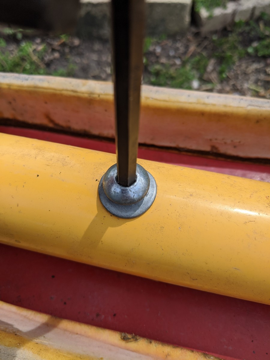 Unscrew the two bolts holding each seat onto the frame. 