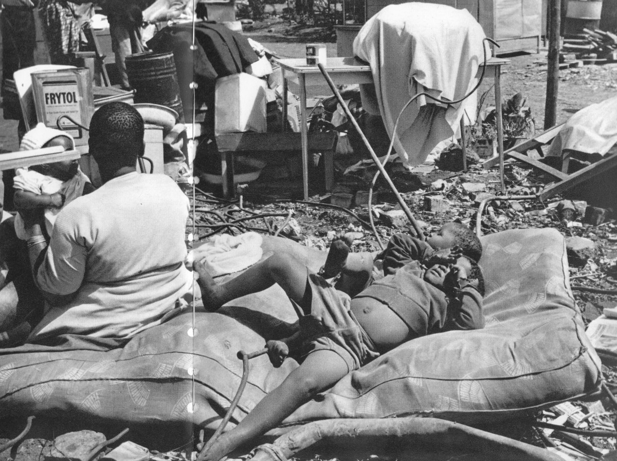 Victims of forced removals dumped outside with their belongs scattered all over and in shambles during the Apartheid era