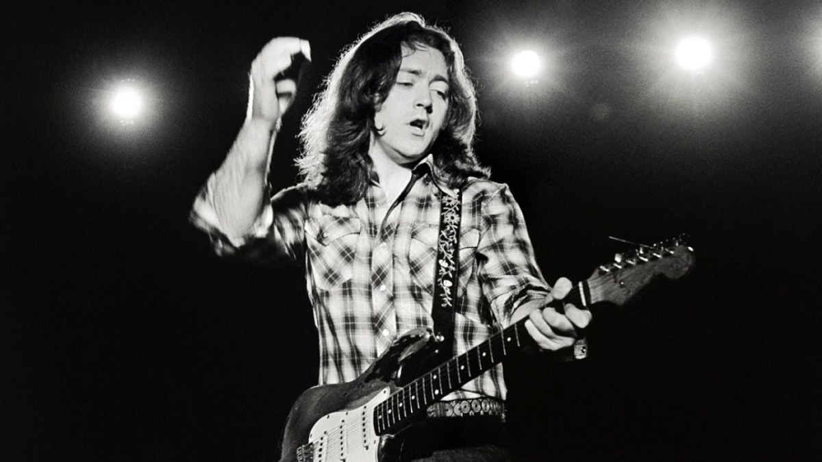 Rory Gallagher on stage with his famous Fender Stratocaster. 