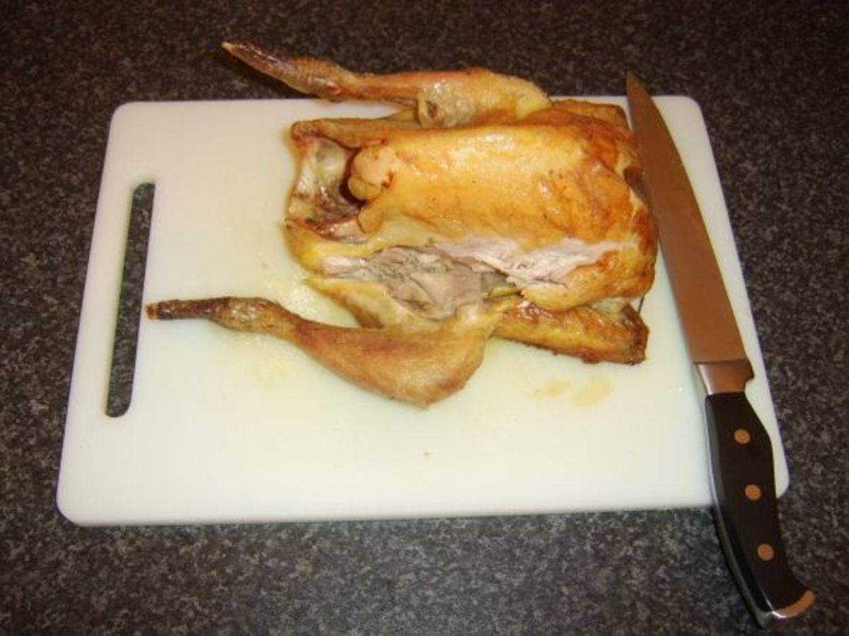 Removing the first leg portion from the guinea fowl