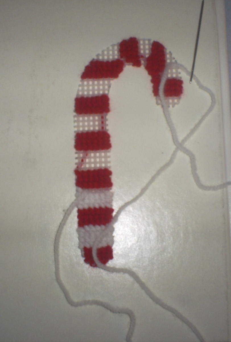 This is what the candy cane looks like after adding the second row of white yarn.