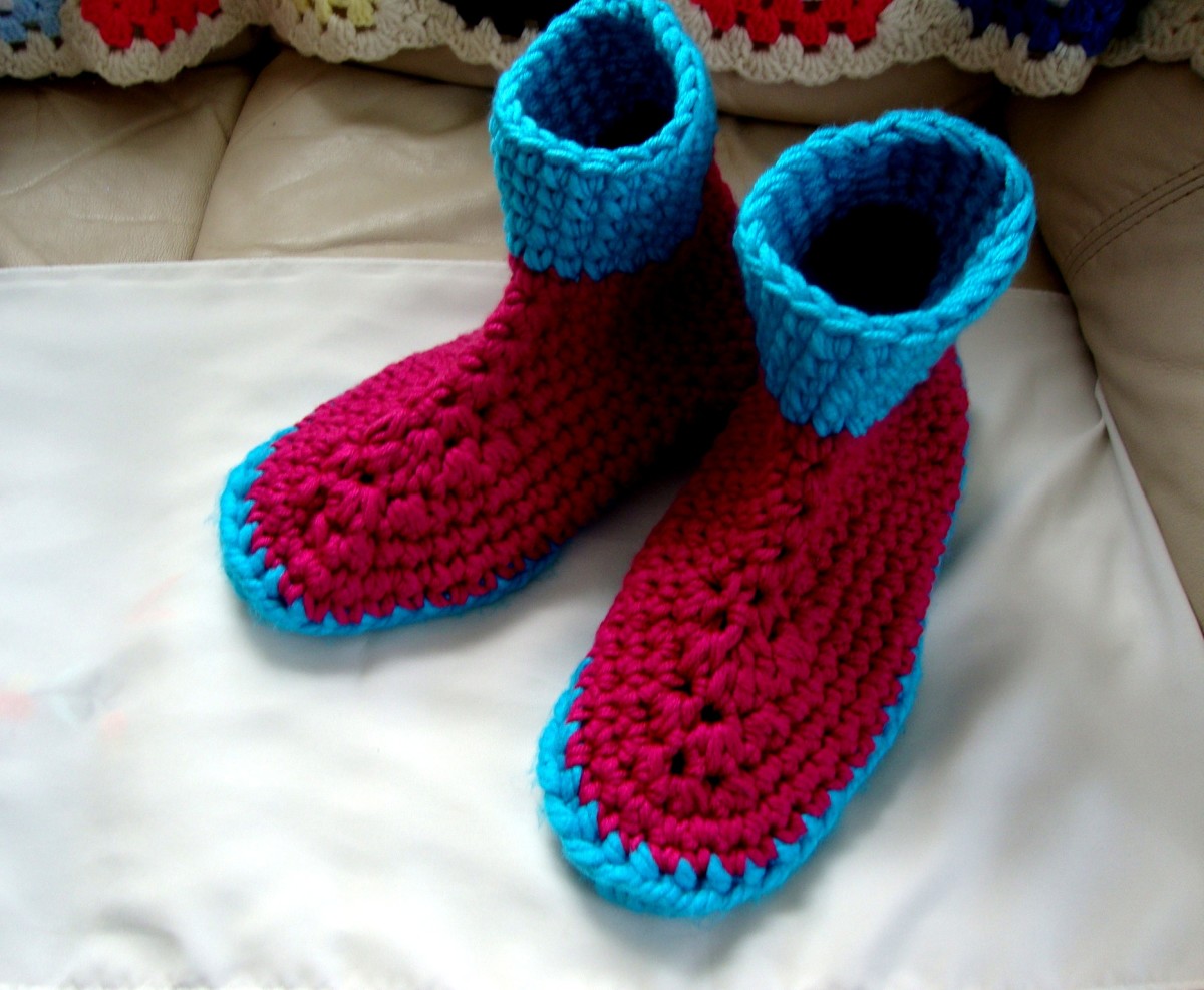 A pair of large men's slippers worked in willow wash yarn.