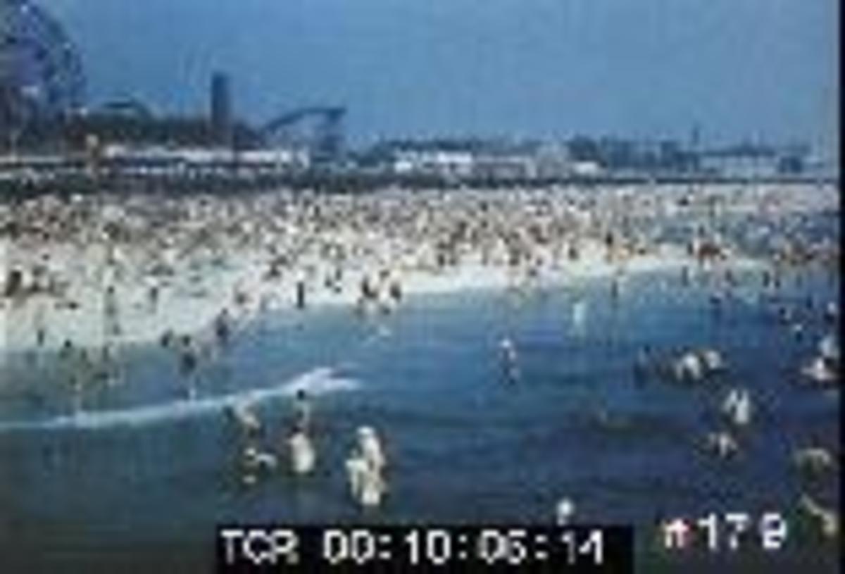 Coney Island Beach in the 50's, and 60's during the peak of summer.
