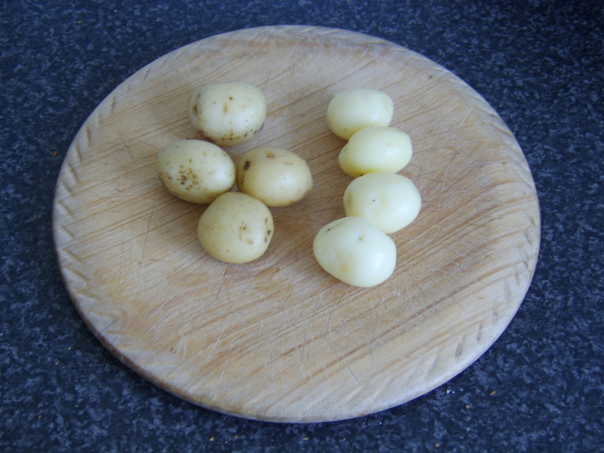Skins are rubbed off the cooked and cooled potatoes