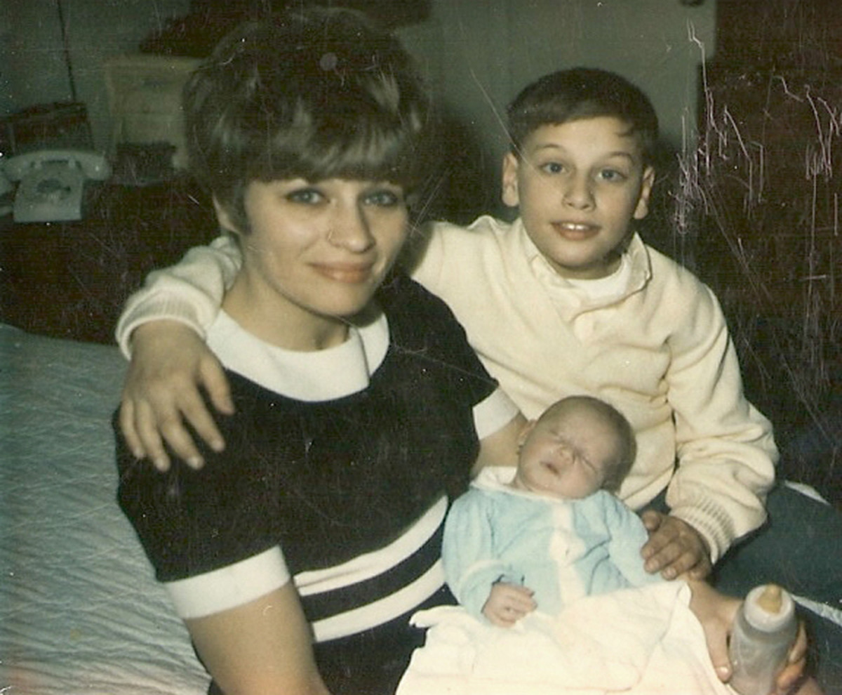 My Mom with my brother holding Peter at his bris. The picture was taken in 1966 Cherry Hill, New Jersey.