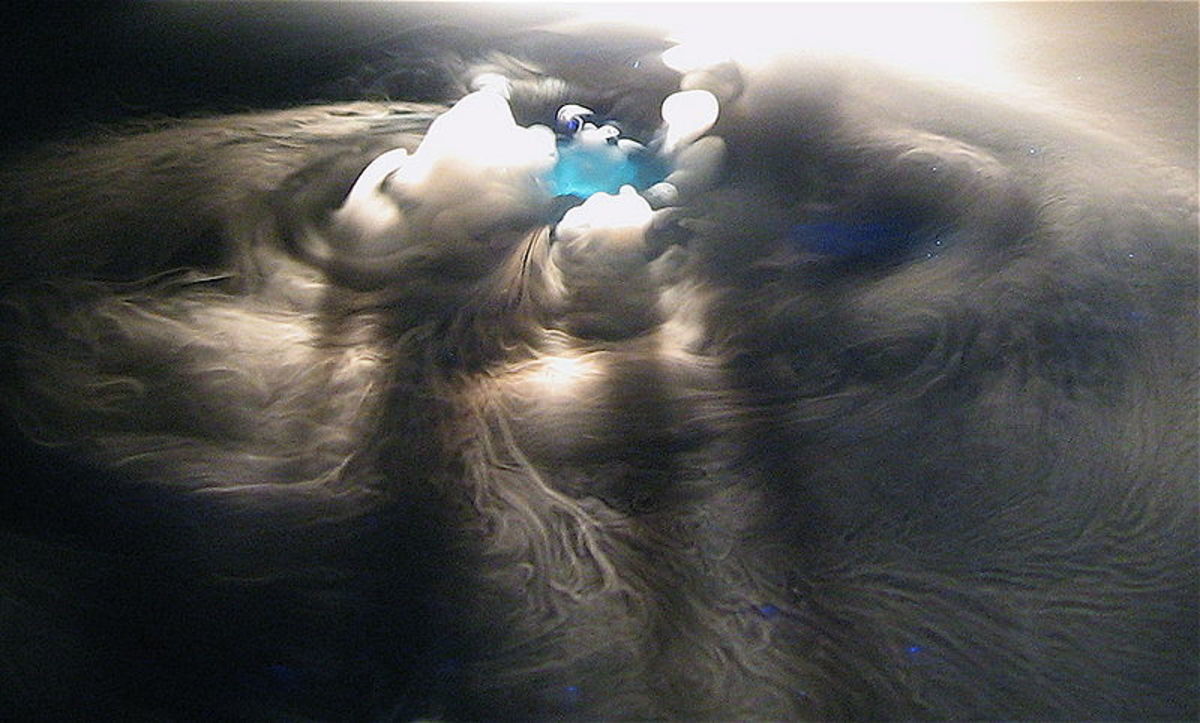 A beautiful photo of dry ice sublimating in water.