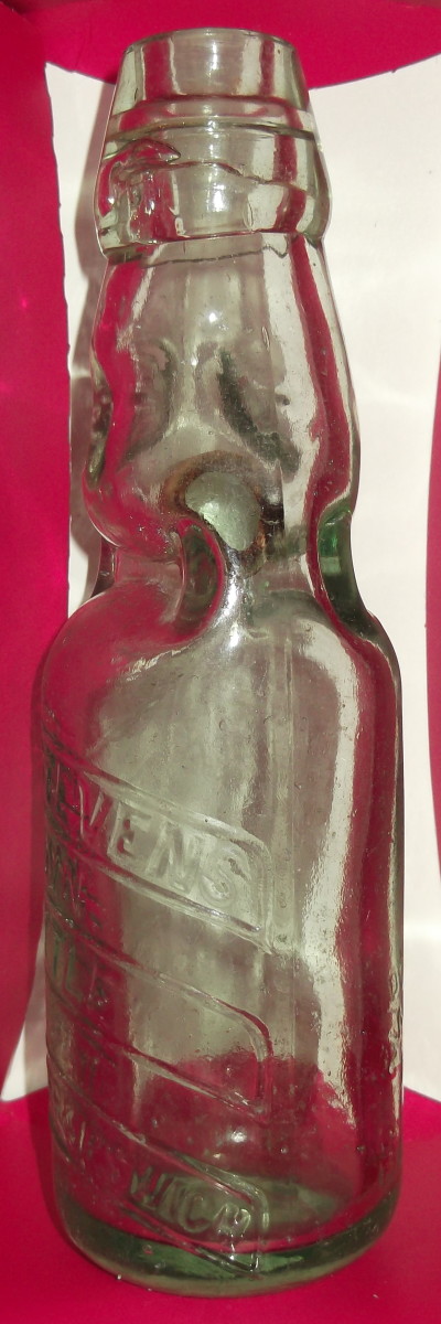 Attributed to Hiram Codd, who invented a bottle for fizzy drinks (1875); the derivation remains unconfirmed. This bottle indeed has a glass ball inside the neck and a felt sealing ring. It is believe it to be much earlier than 1875.
