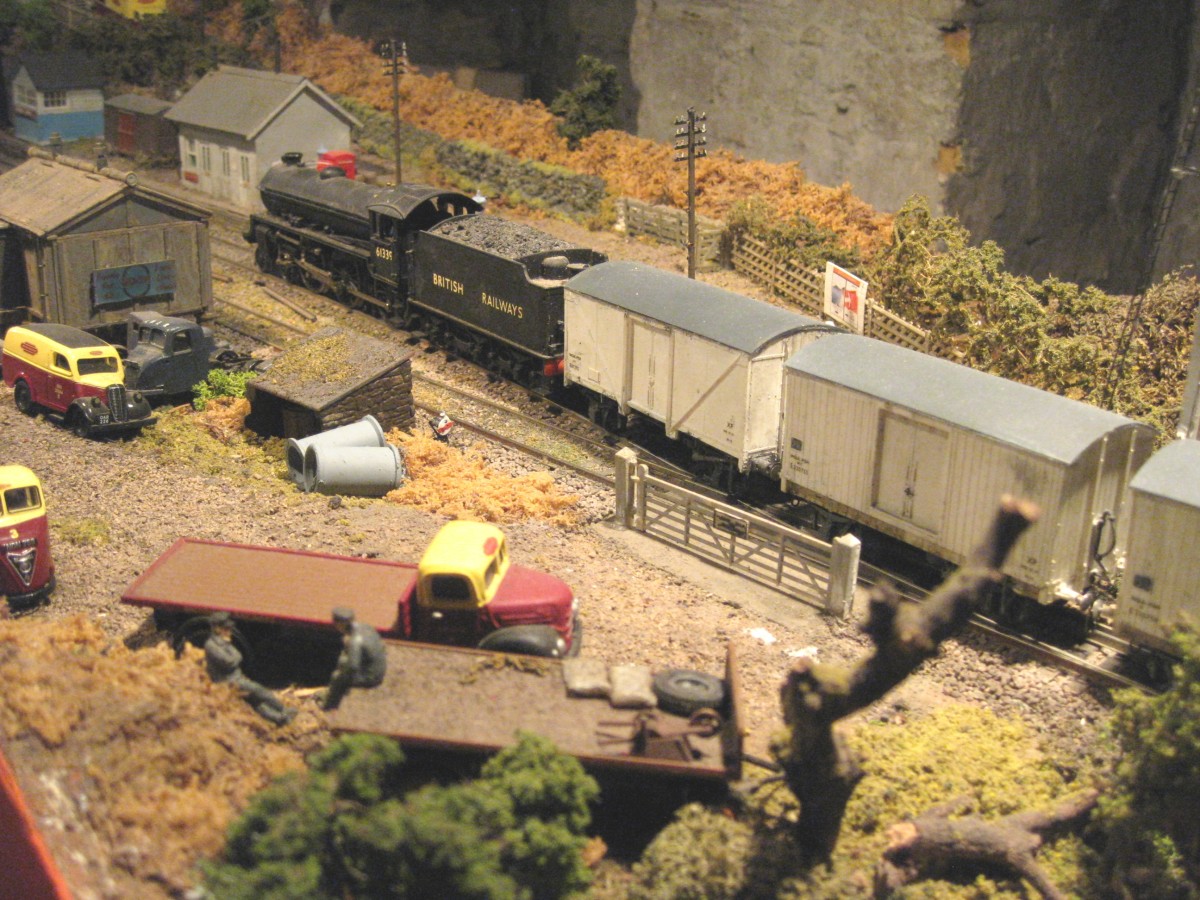 Unnamed class B1 4-6-0 61339 passes Ayton Row Station (closed to passengers) with a short train of fish vans, several ex-LNER wooden-bodied, as many BR-built steel-bodied.  Viewed at the 'occupation crossing' with the goods depot in the foreground  
