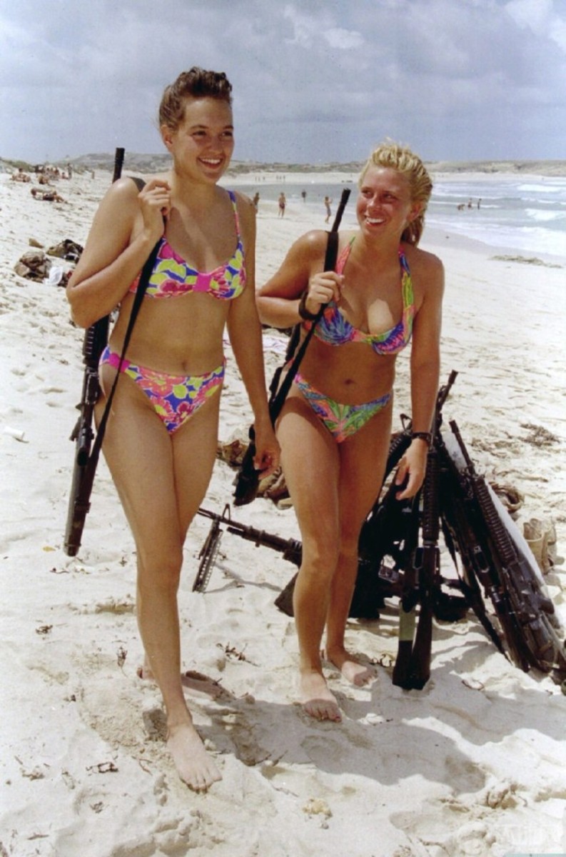 Israeli girls on beach with bikinis and guns