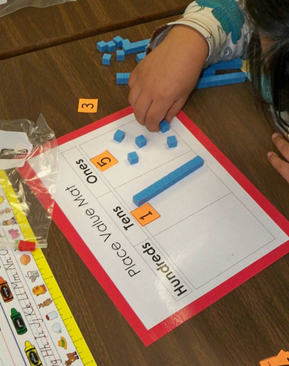 Instead of using plastic cubes, use candy corn with the place value mats that you already have.