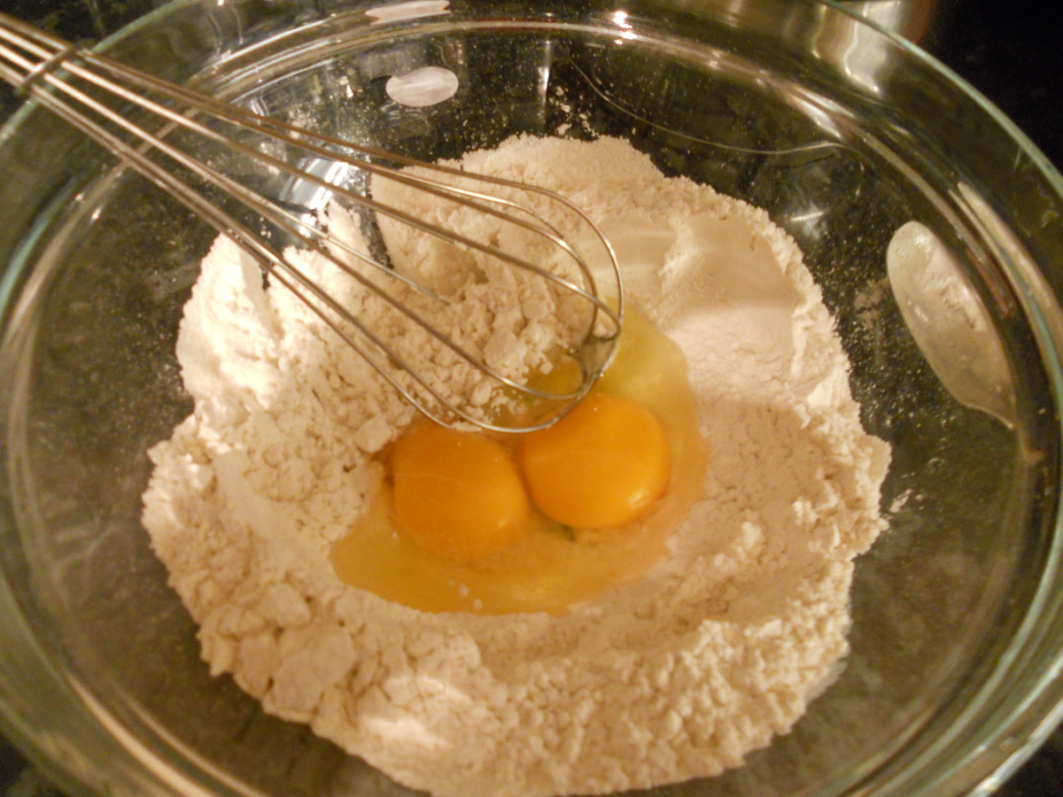 Make a well in the centre of the flour and whisk in the eggs and milk