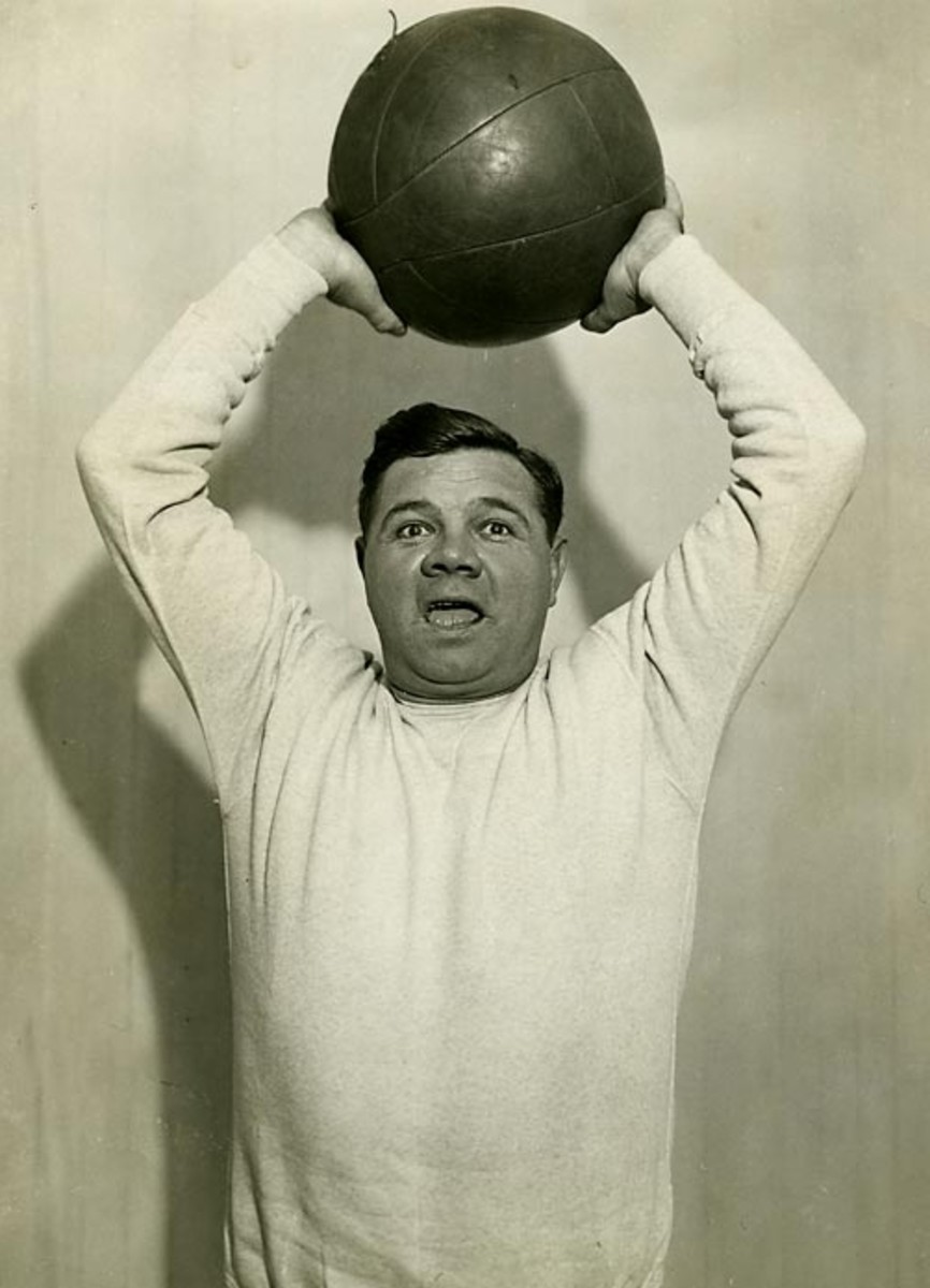 The Babe throwing the medicine ball at Artie McGovern's gym in 1932.  Exercise saved his career.