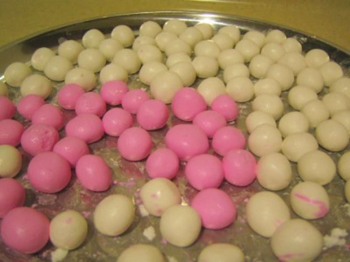 a plate of red and white rice balls
