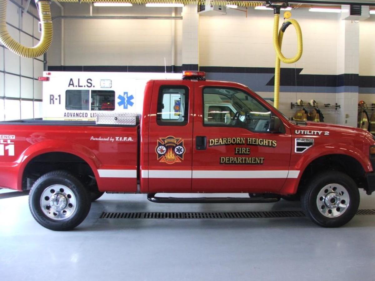 A utility truck sitting in an engine bay.