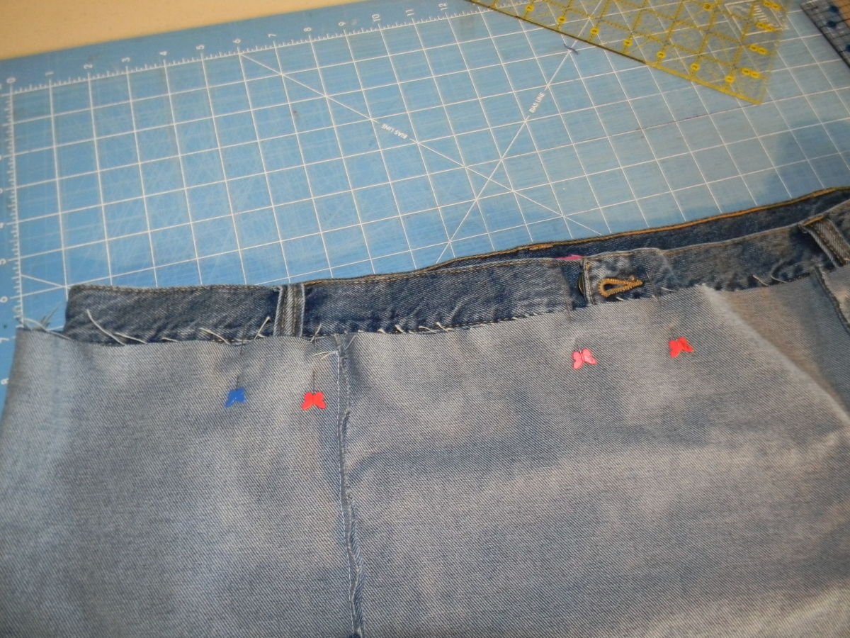 Pins to mark either side of belt loops and zipper.
