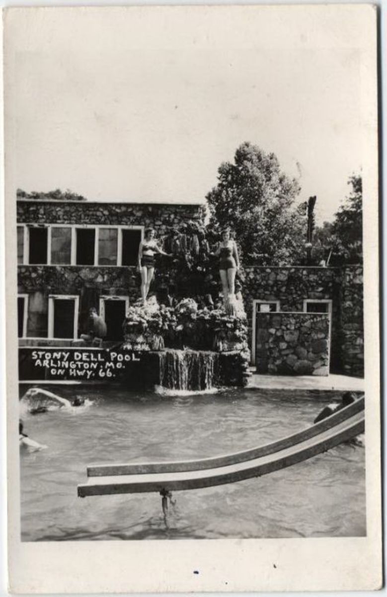 Two women stand on the spring water fountain feeding the pool at Stony Dell Resort