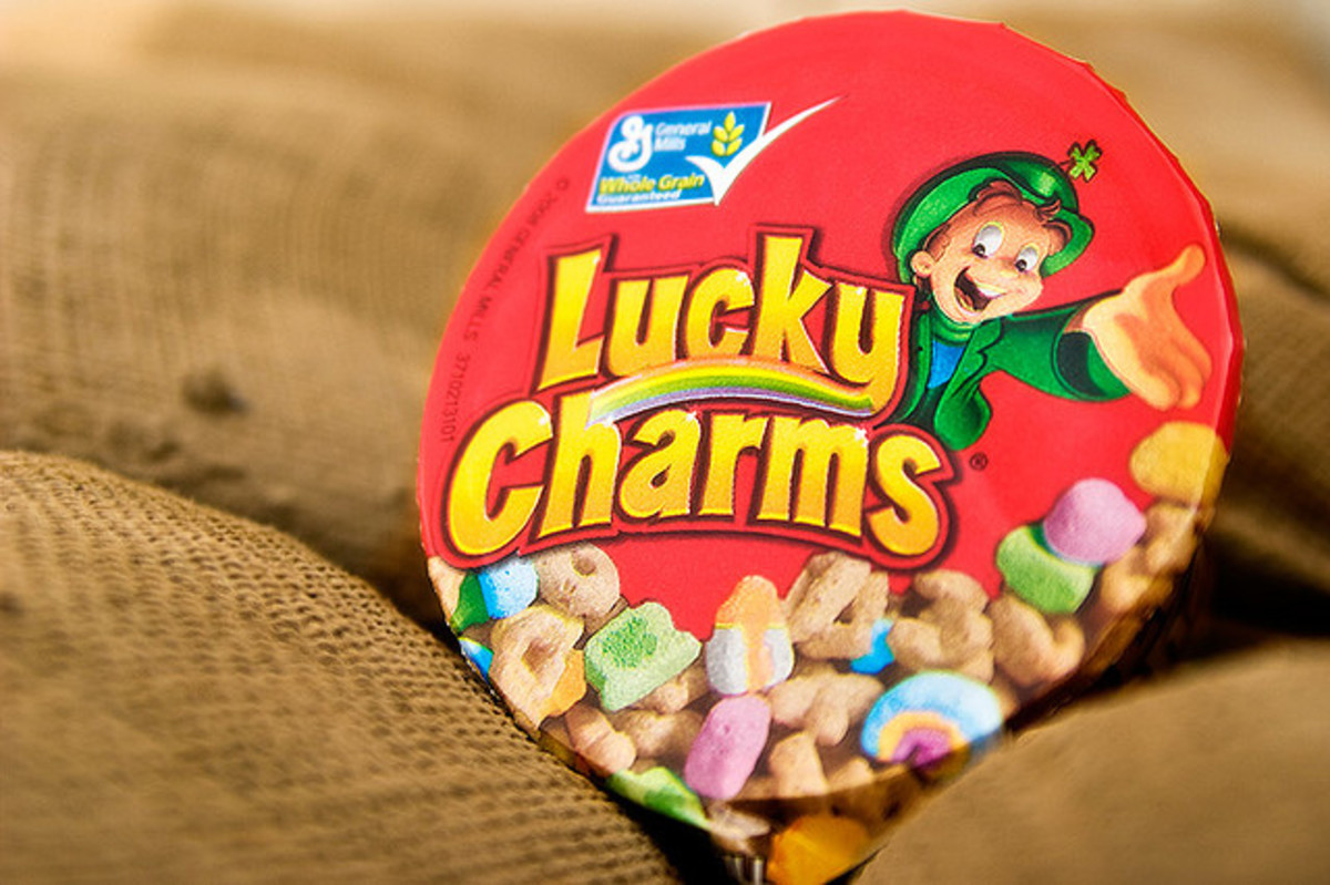 Lucky Charms features a smiling Leprechaun. They are "magically delicious!"
