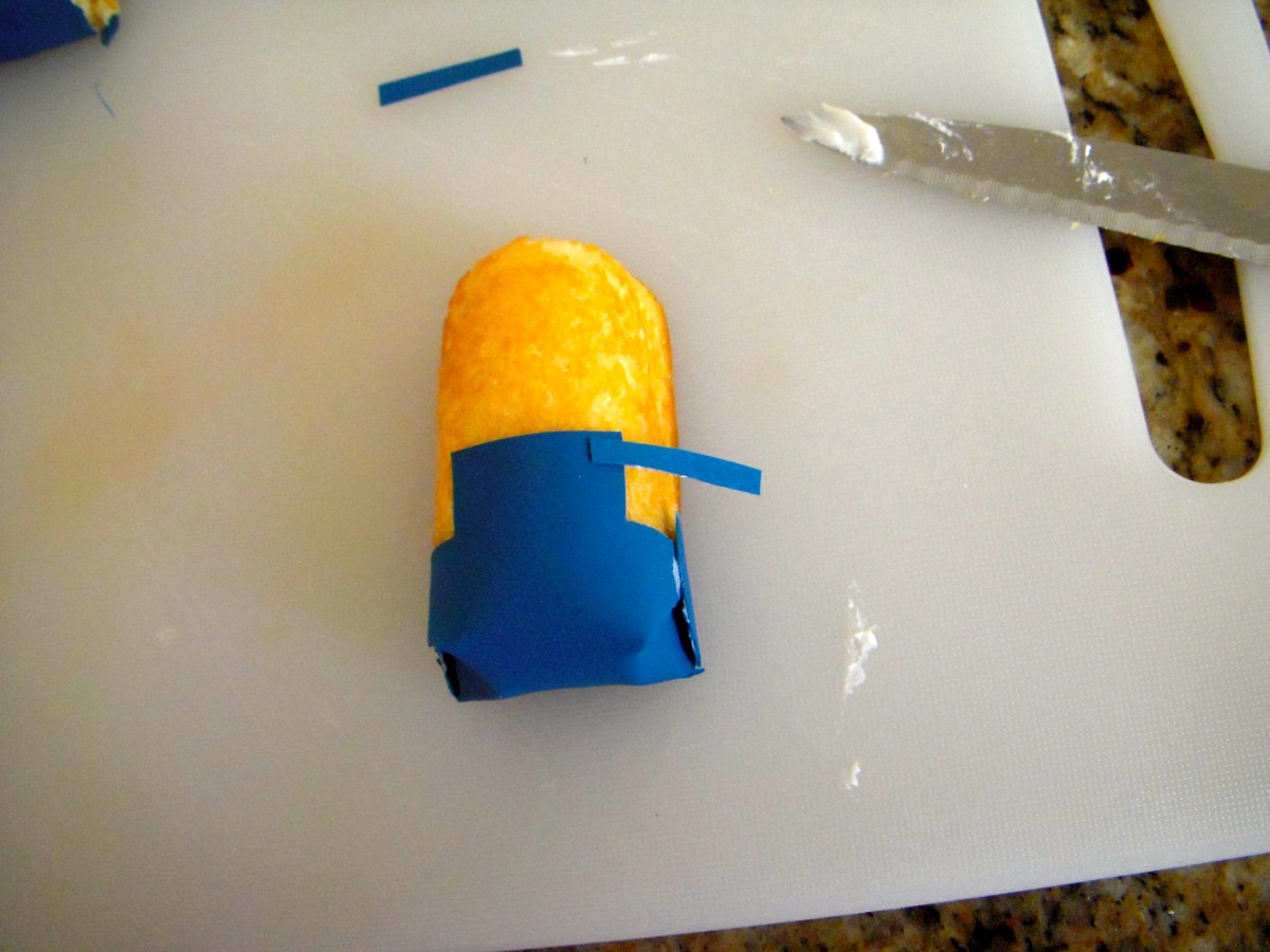 Carefully place suspenders around Twinkie, front to back. The suspenders should slightly overlap the bib.