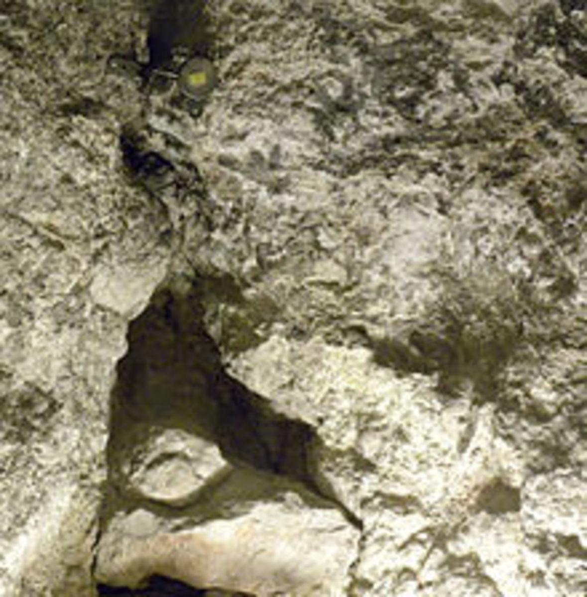Natural stone of Golgotha in the Chapel of Adam 