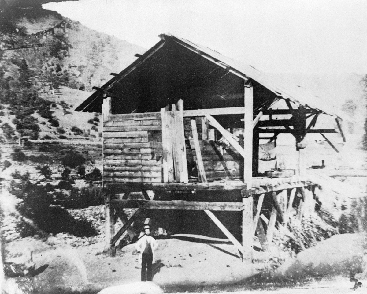 "Photomechanical reproduction of the 1850 daguerreotype shows James Marshall standing in front of Sutter's sawmill, Coloma, California, where he discovered gold." Person depicted is most likely not actually Marshall.