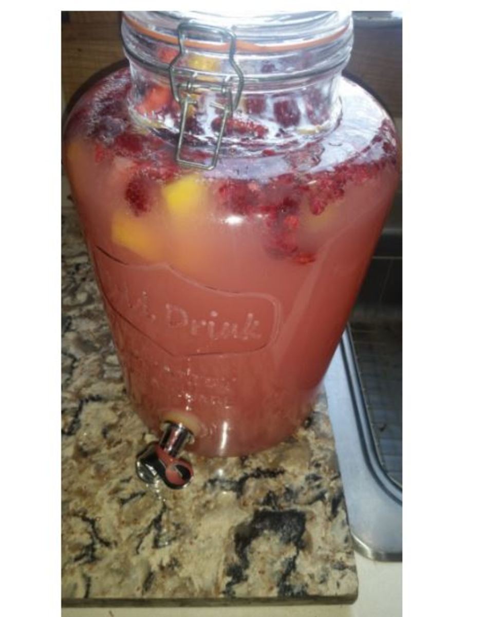 Pink Lemonade, Ginger Ale and frozen raspberries and peaches, mango and pineapple chunks.