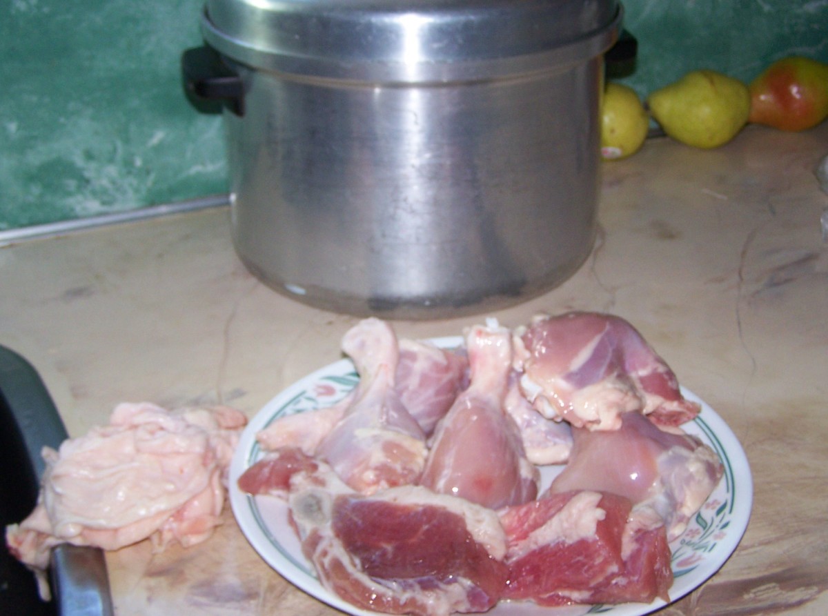 Boiled dinner meat ready for browning, chicken skin and excess fat removed on left