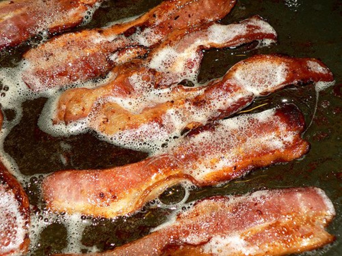 Sizzling bacon in a cast iron skillet