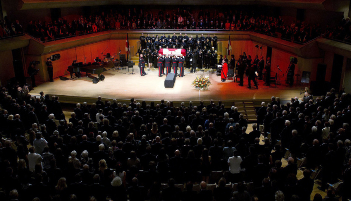 Pallbearers carry the coffin of late NDP leader Jack Layton at his state funeral service in Roy Thomson Hall.