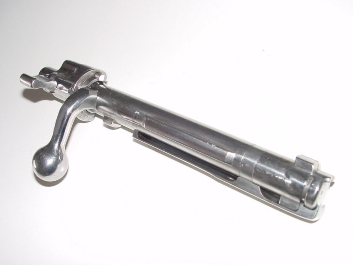 Mauser 98 bolt showing large claw extractor for controlled round feed