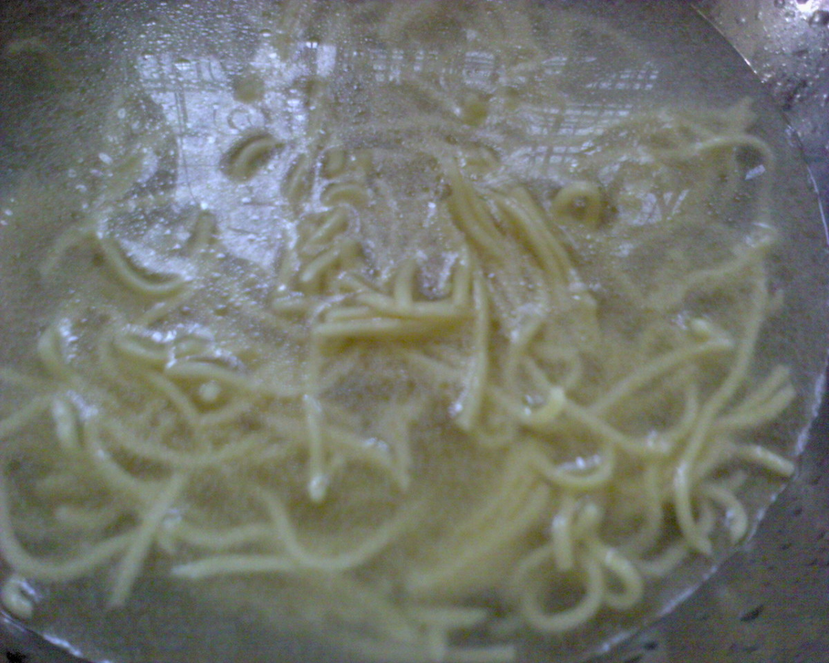 oily bowl of yellow noodles