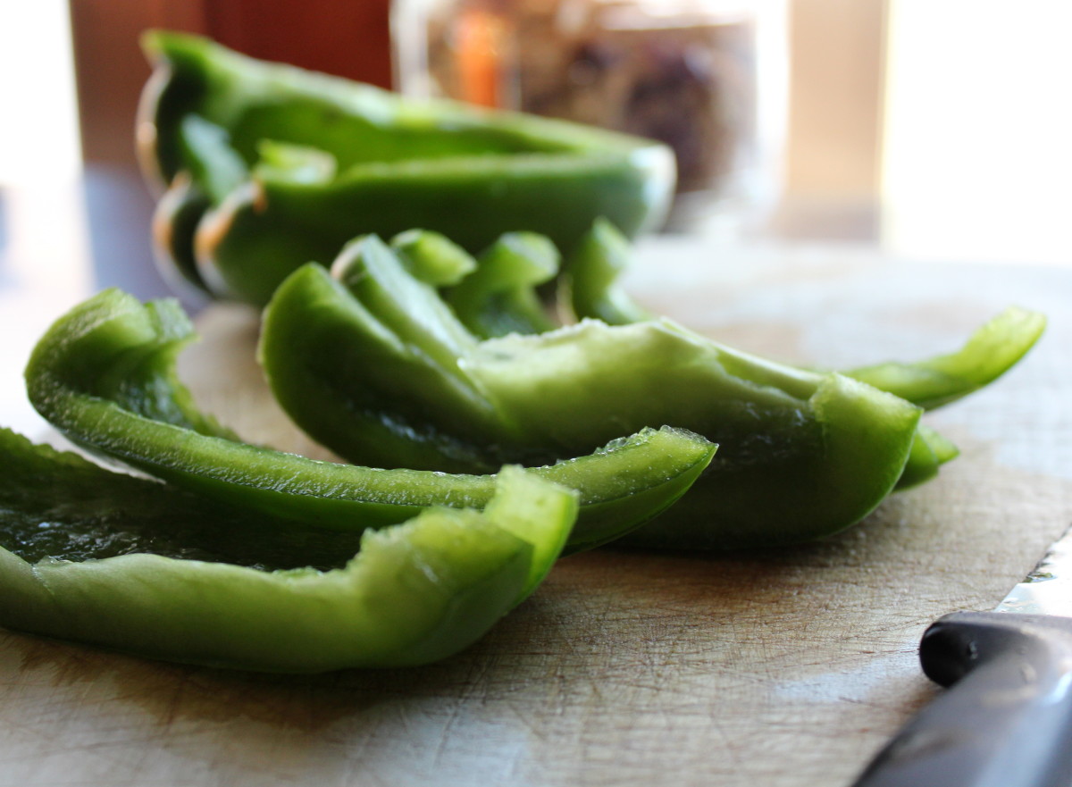 Chopping green peppers for chicken salad.