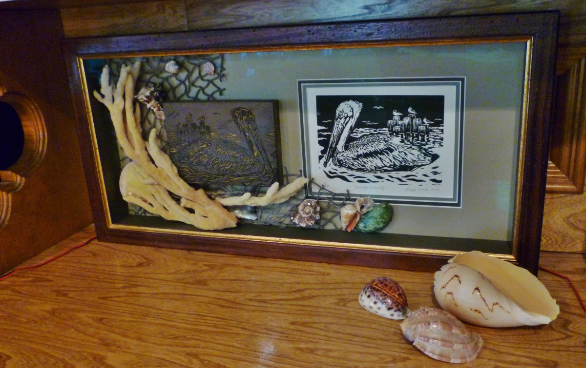 I had the carved linoleum block along with some fishnet, sponge, and shells framed with my signed & numbered linocut titled "Seaside Serenity."
