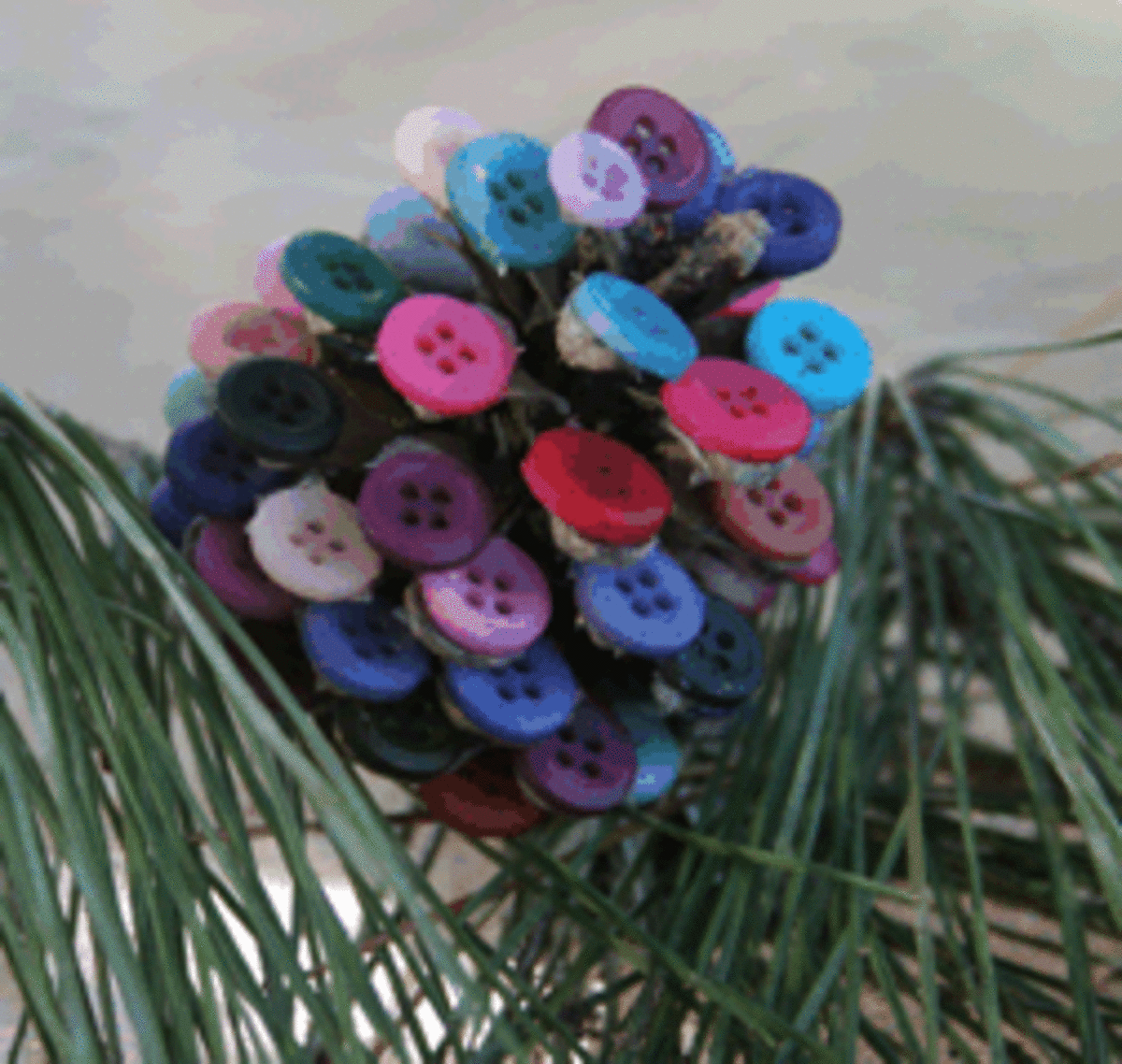 cute button embellished pine cone 