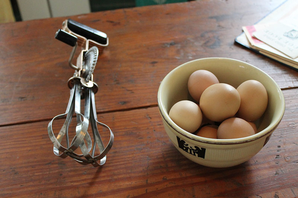 Hand crank egg beater.  Reproduction Country Egg Beater is still available.