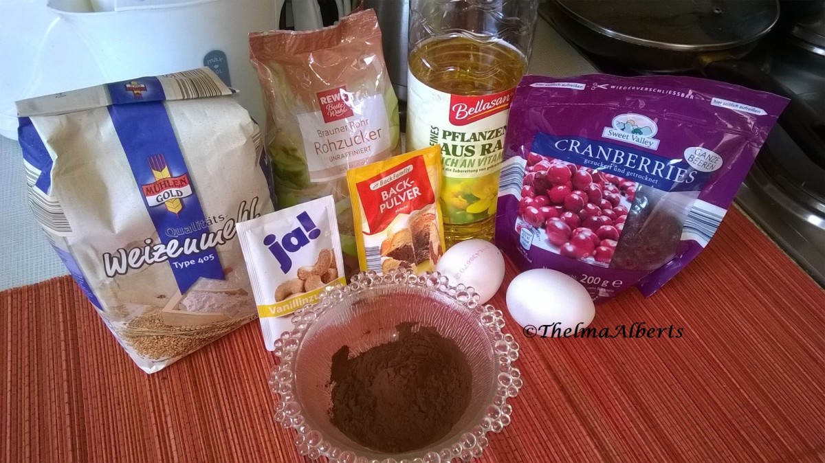 All purpose flour, brown sugar, baking powder, vanilla sugar, vegetable oil, cocoa, dried cranberries and eggs.