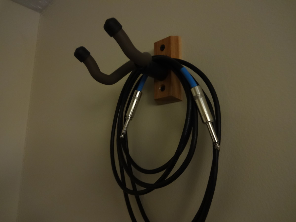 Guitar wall hangers are a great way to protect guitars and get them out of the way.