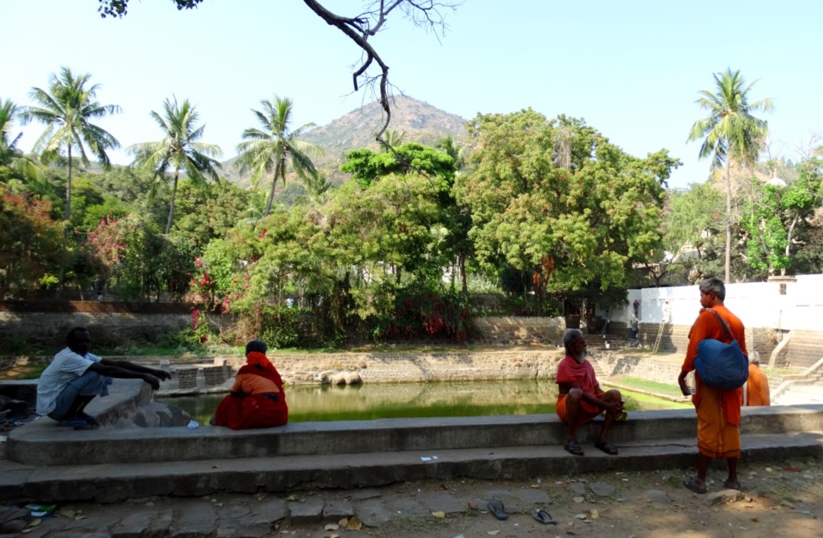 Few devotees resting under a tree