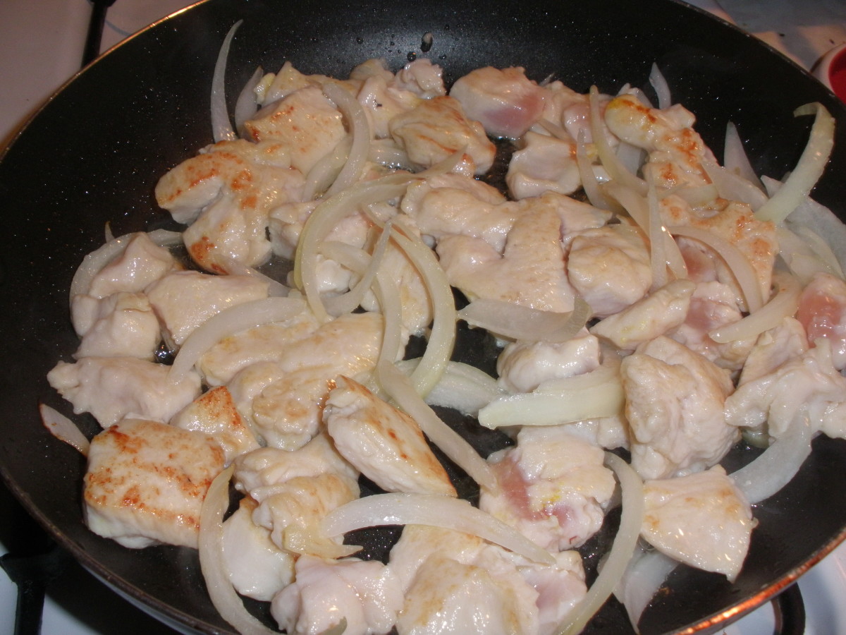 In this photo, I started with oil and sliced onions, but did not wait until the onions were sauteed before adding the chicken.