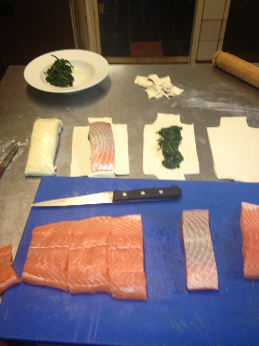 In this picture you can see the steps taken, Cutting the corners off,adding the spinach,then the salmon, and a finished parcel.