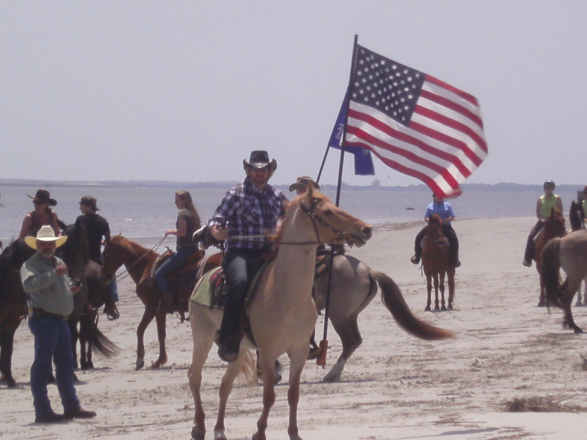 American Flag on horseback at Marsh Tacky Beach Races in South Carolina