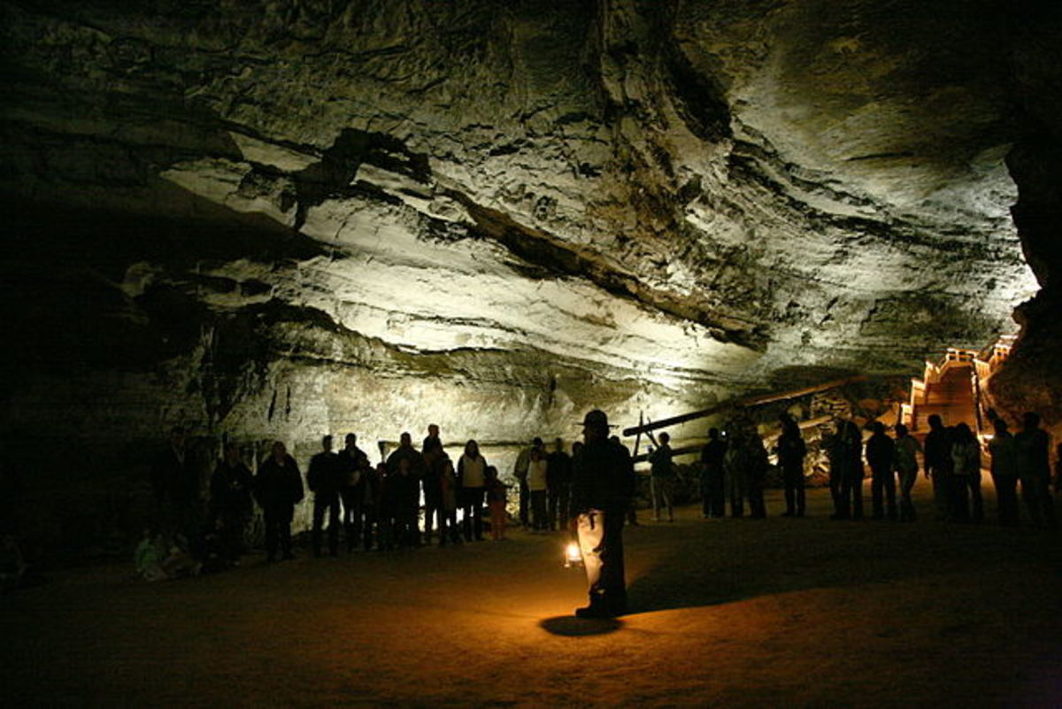 A national park ranger guiding tourists through Mammoth Cave.