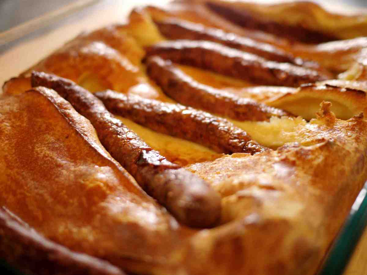 A British Classic - Toad in the hole - with a twist you will love. Toad in the hole with bacon wrapped sausages.