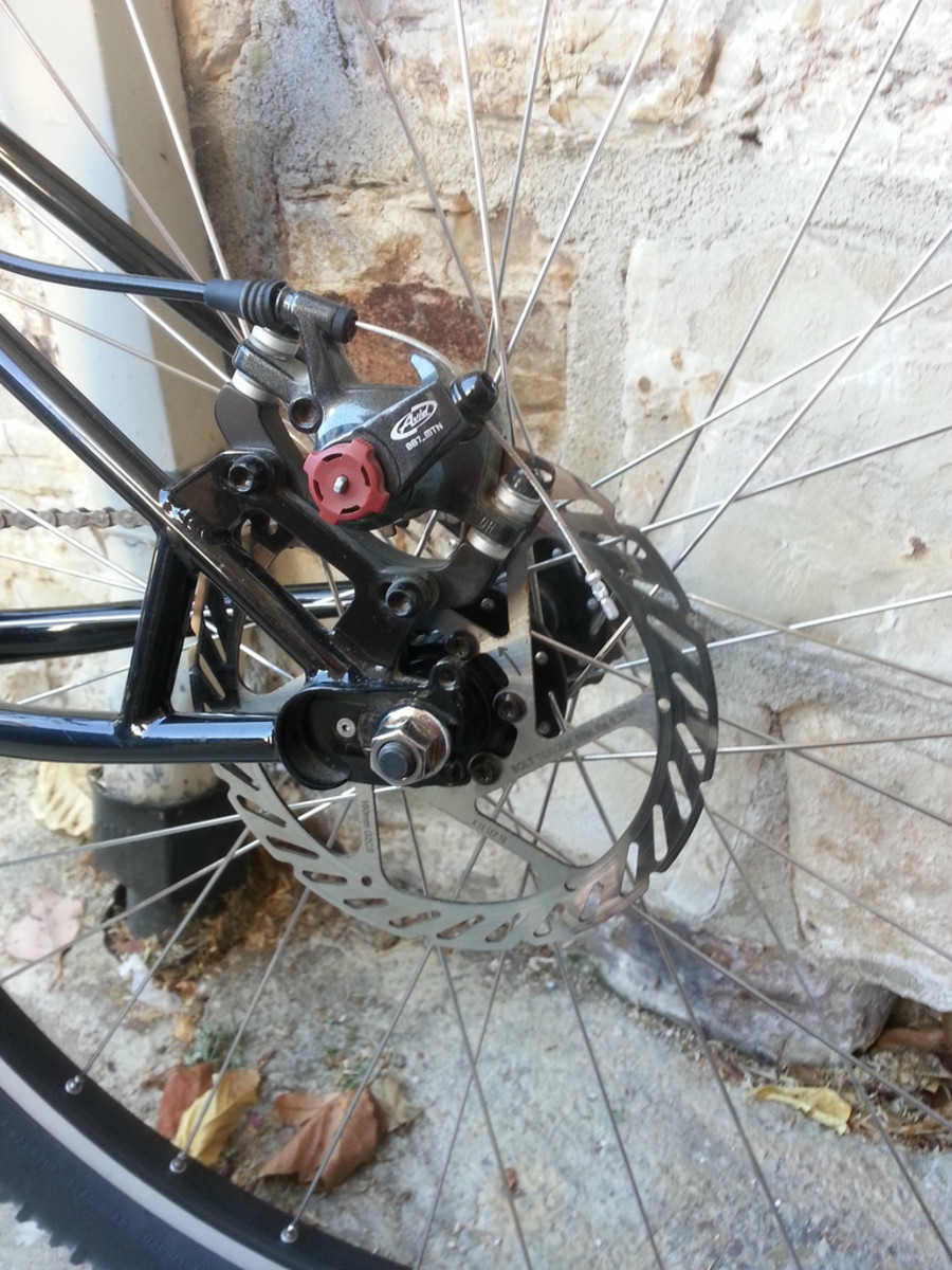 A mechanical disc brake. You can see the two lateral adjustment bolts on the backside. 