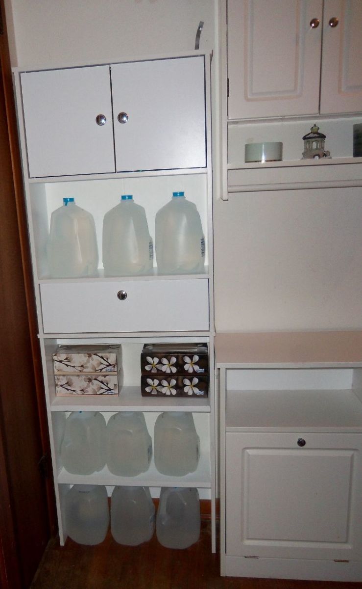 The water storage is no longer a problem with the newly installed cabinet.