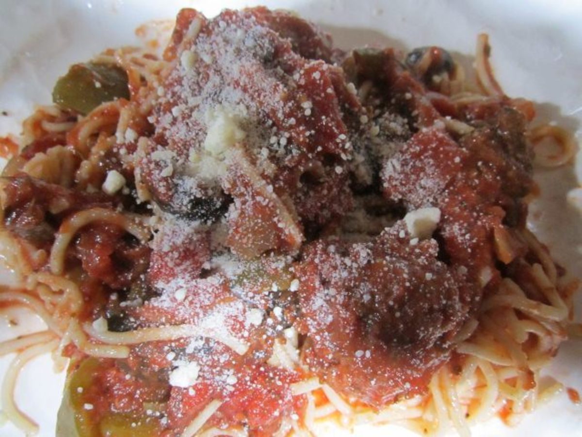 Spahetti and meatballs with sprinkled grated Parmesan cheese on top!