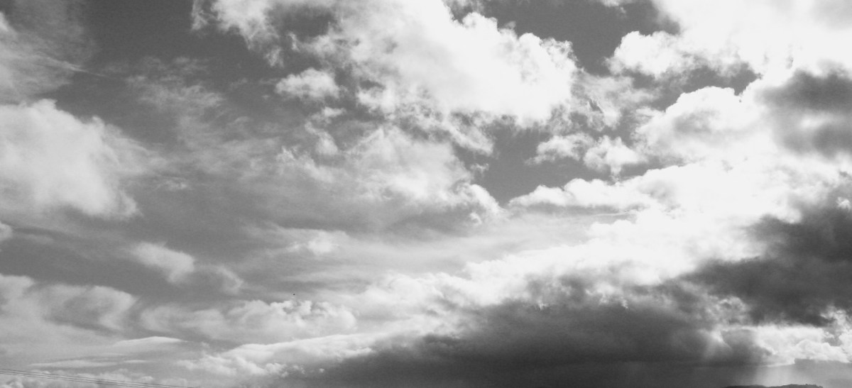 A beautiful blue sky full of fluffy white clouds can be transformed into broody storm clouds just by changing the photo to black and white and adjusting the exposure.