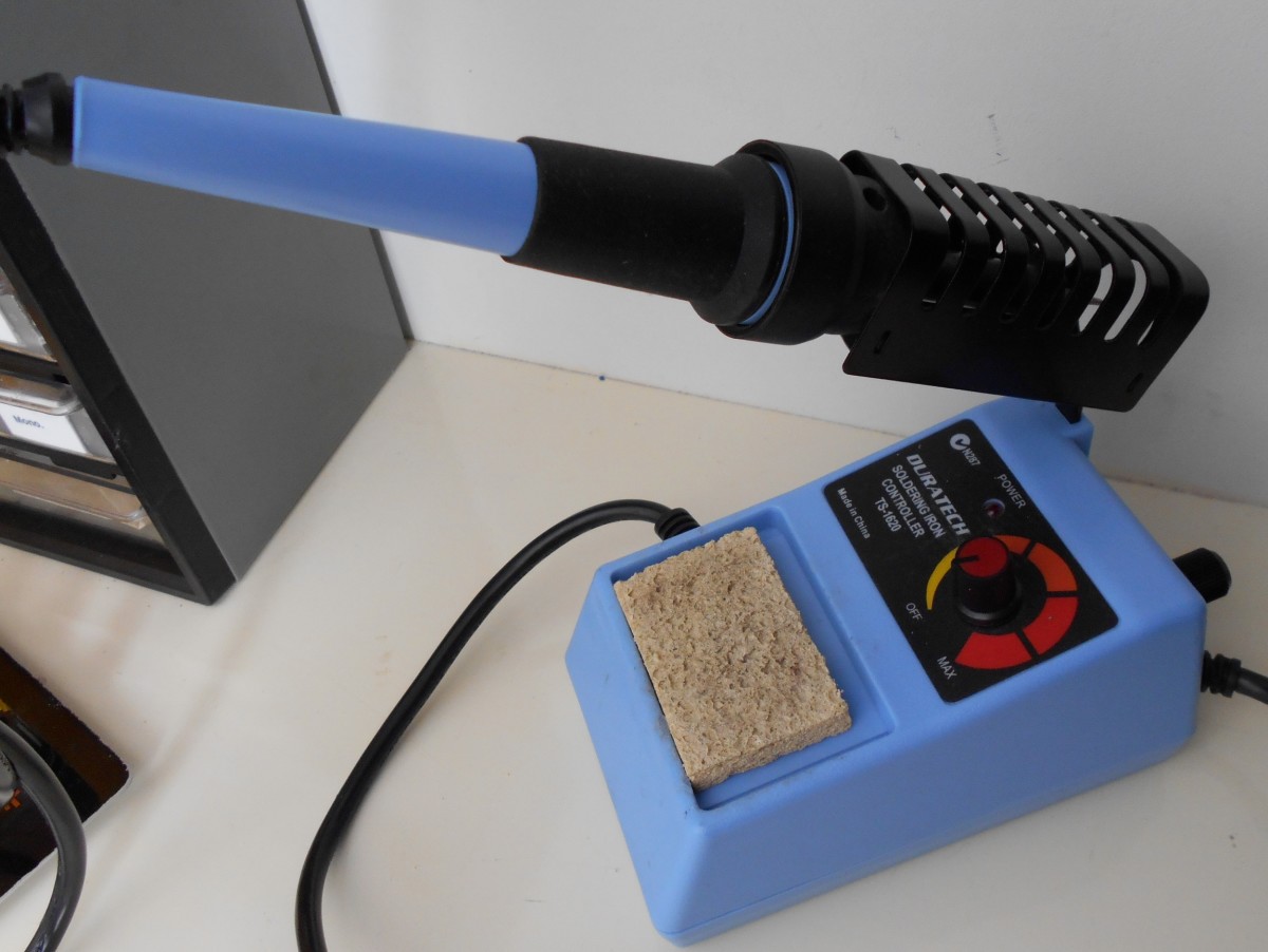 A soldering iron station with soldering iron, a stand, temperature controller and cleaning sponge. This item is $60.