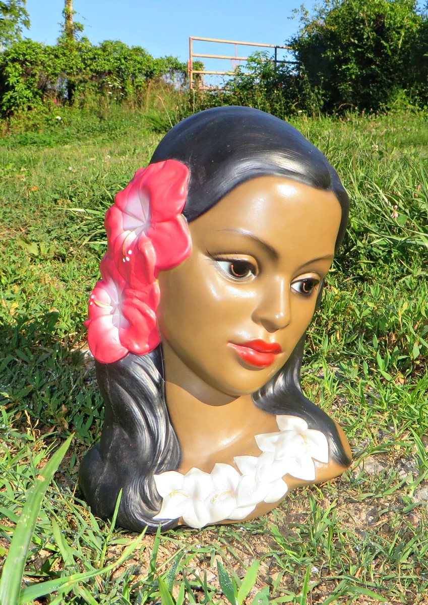 The hibiscus flower being worn in this head bust is the type that is traditionally worn by Polynesian, Tahitian, and Hawaiian girls. 